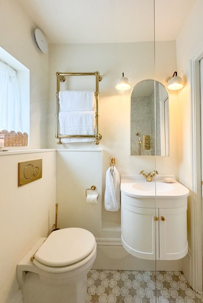 Elegant White Bathroom with Gold Accents