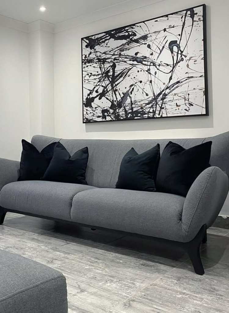 Contemporary Dark Gray Sofa with Abstract Wall Art