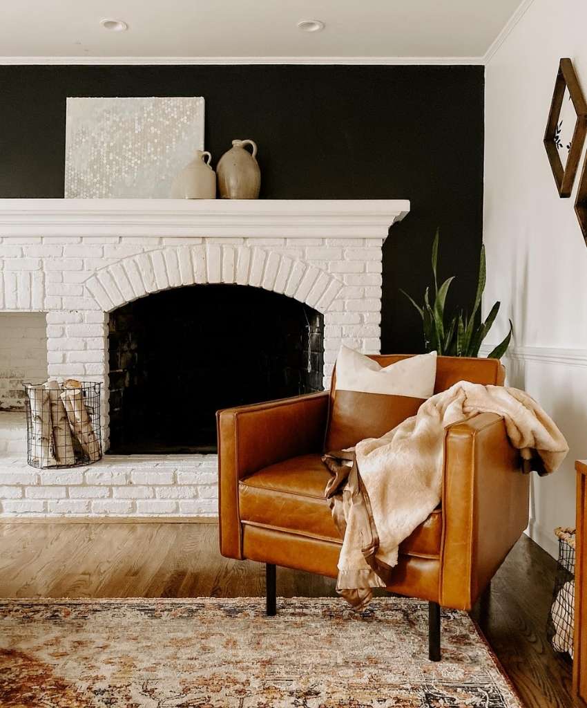 White Brick Fireplace with Bold Black Accent Wall