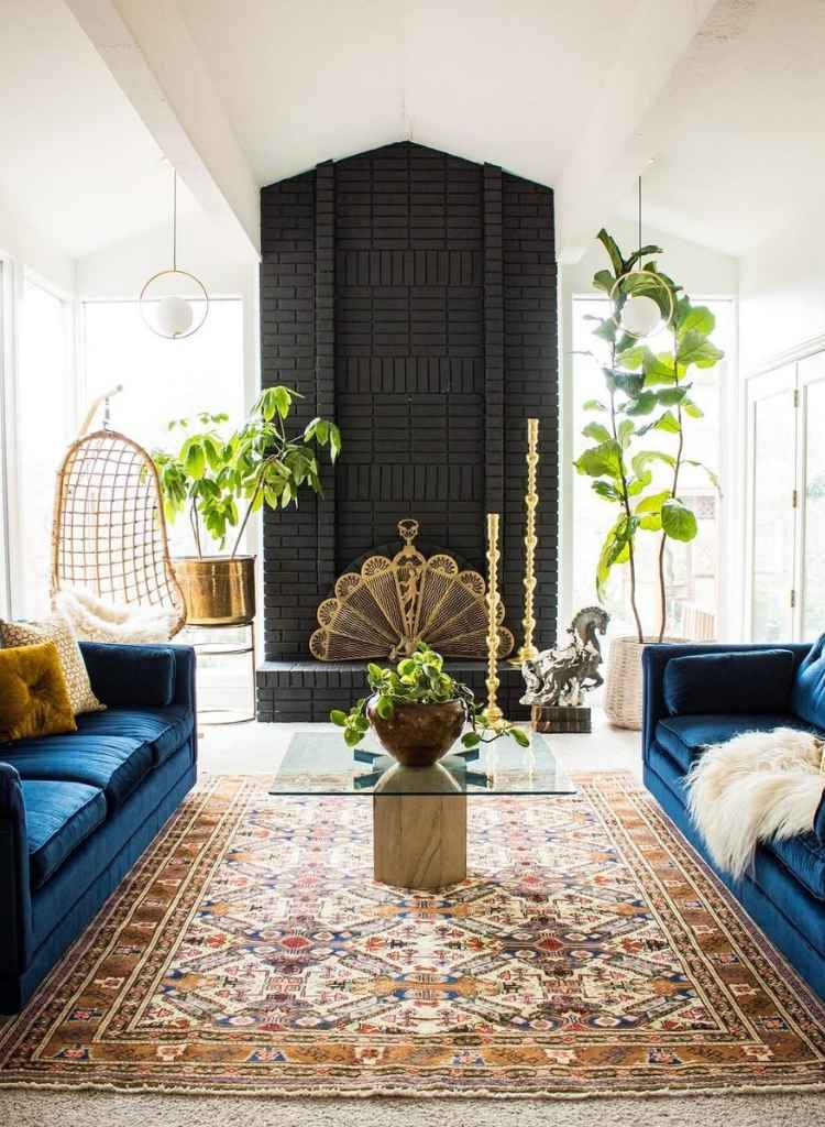 Eclectic Living Room with Tall Brick Fireplace