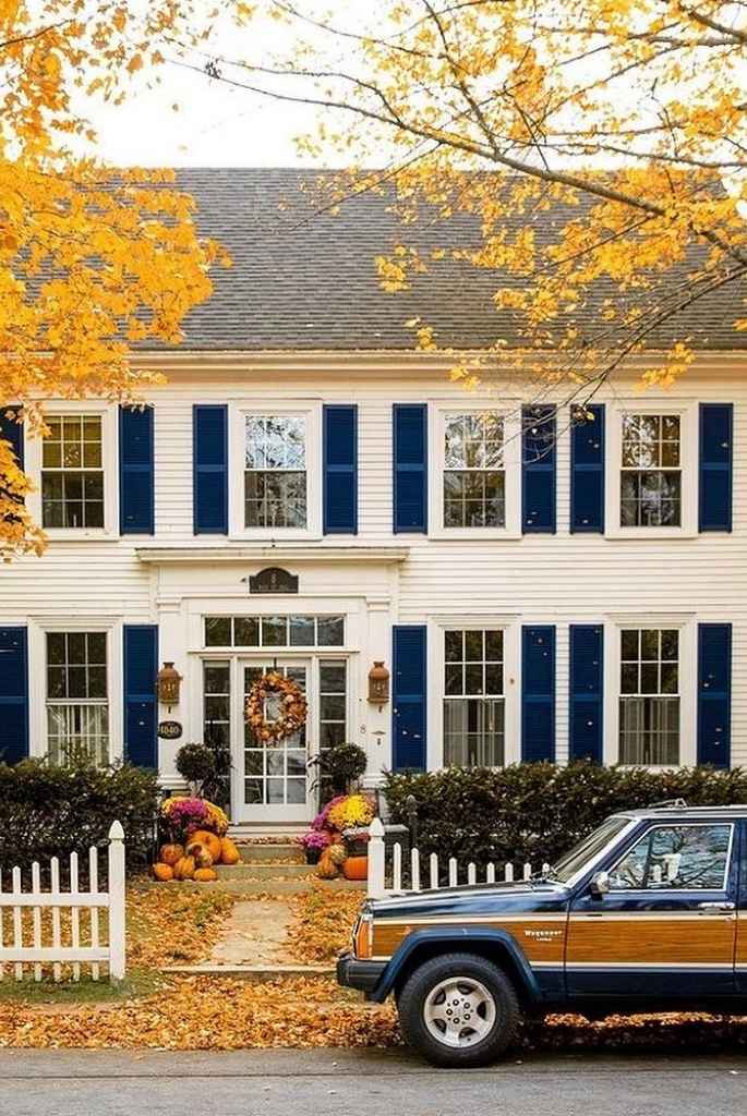 White Colonial with Navy Shutters