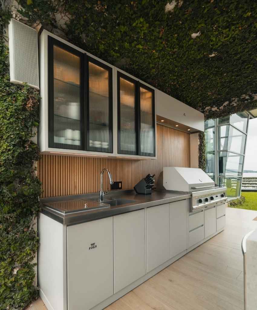 Outdoor Kitchen with Greenery and Stainless Steel