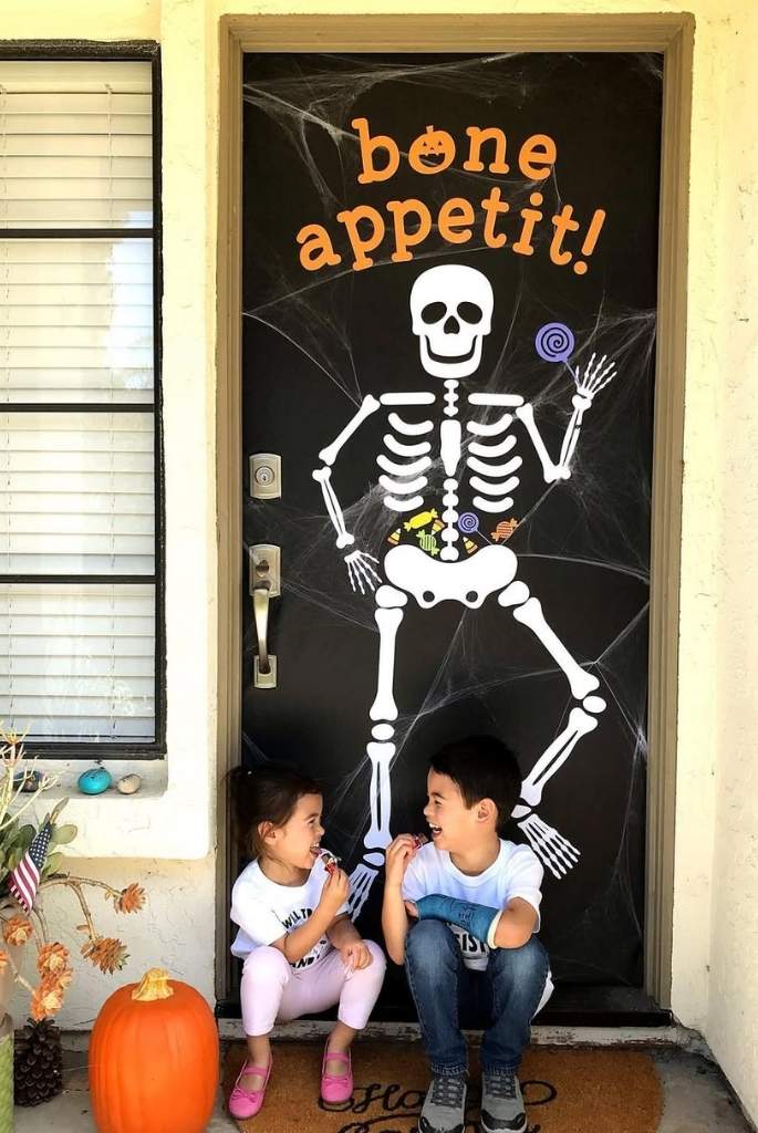 Candy-Loving Skeleton Door Decor