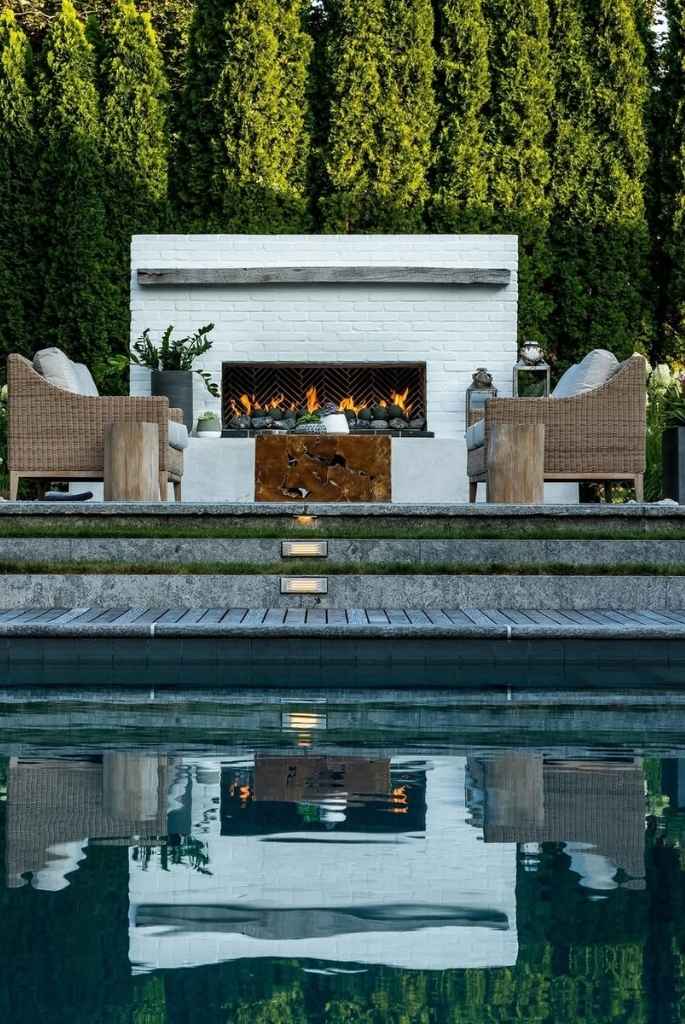 Poolside Fireplace Lounge with Woven Armchairs