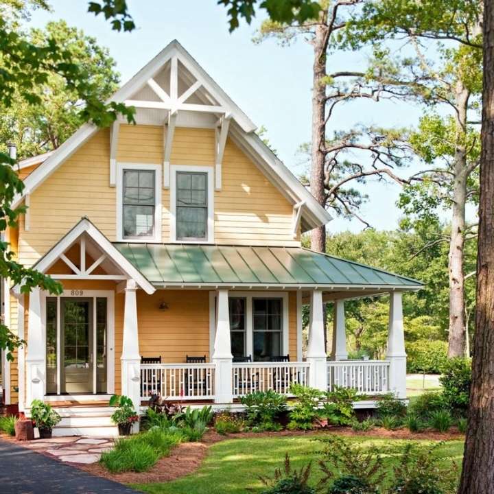 Soft Yellow and White Exterior with Green Roof