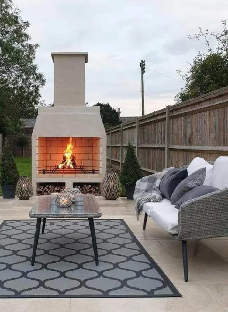 Outdoor Stone Fireplace with Cozy Patio Setup