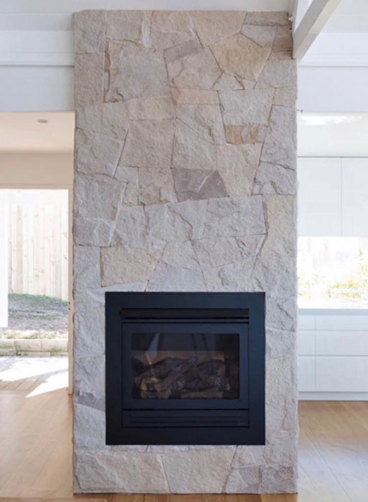 Soft Sandstone Fireplace With Clean Black Insert