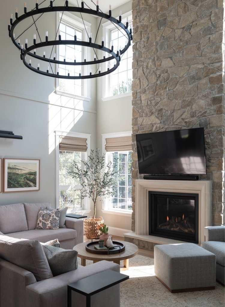 Tall Stone Fireplace With Soft Living Room Glow