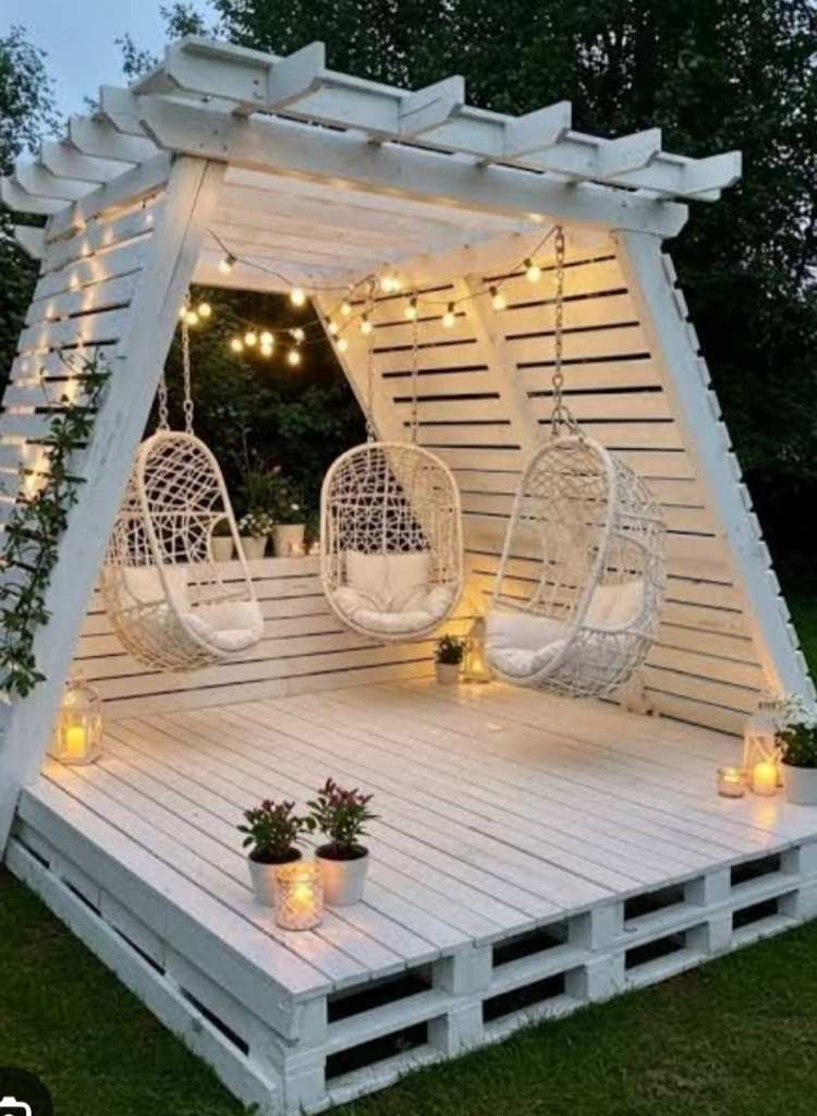 White Pergola with Hanging Chairs