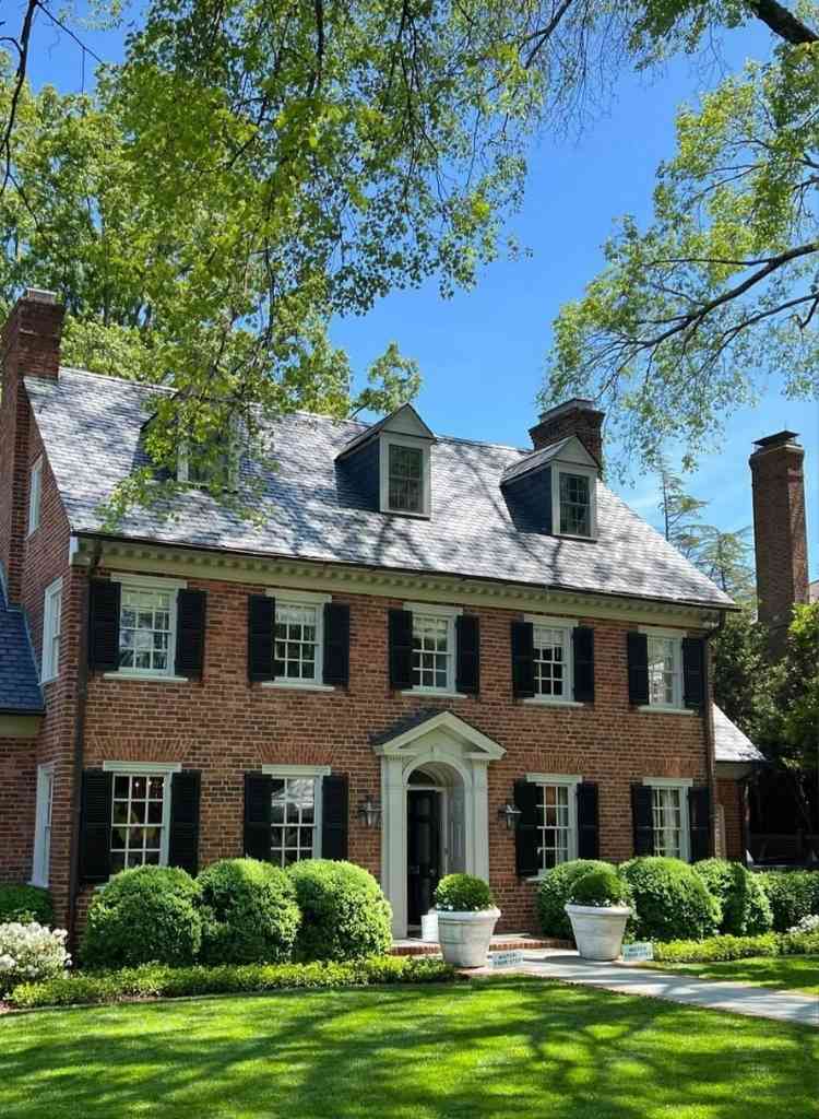 Classic Brick Home Under Tree Canopy